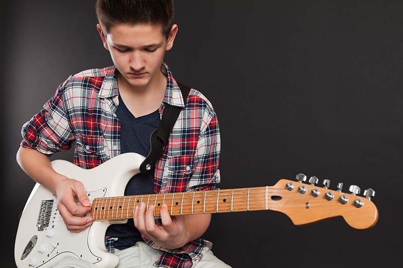 Boy Playing Fender Guitar 360 Mississauga Guitar Academy