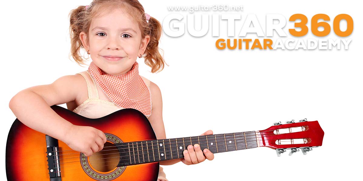 little girl playing guitar